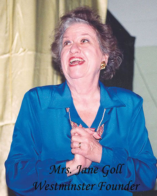 Jane Goll is a woman wearing a blue blouse