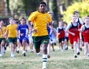 boy running in a race outside