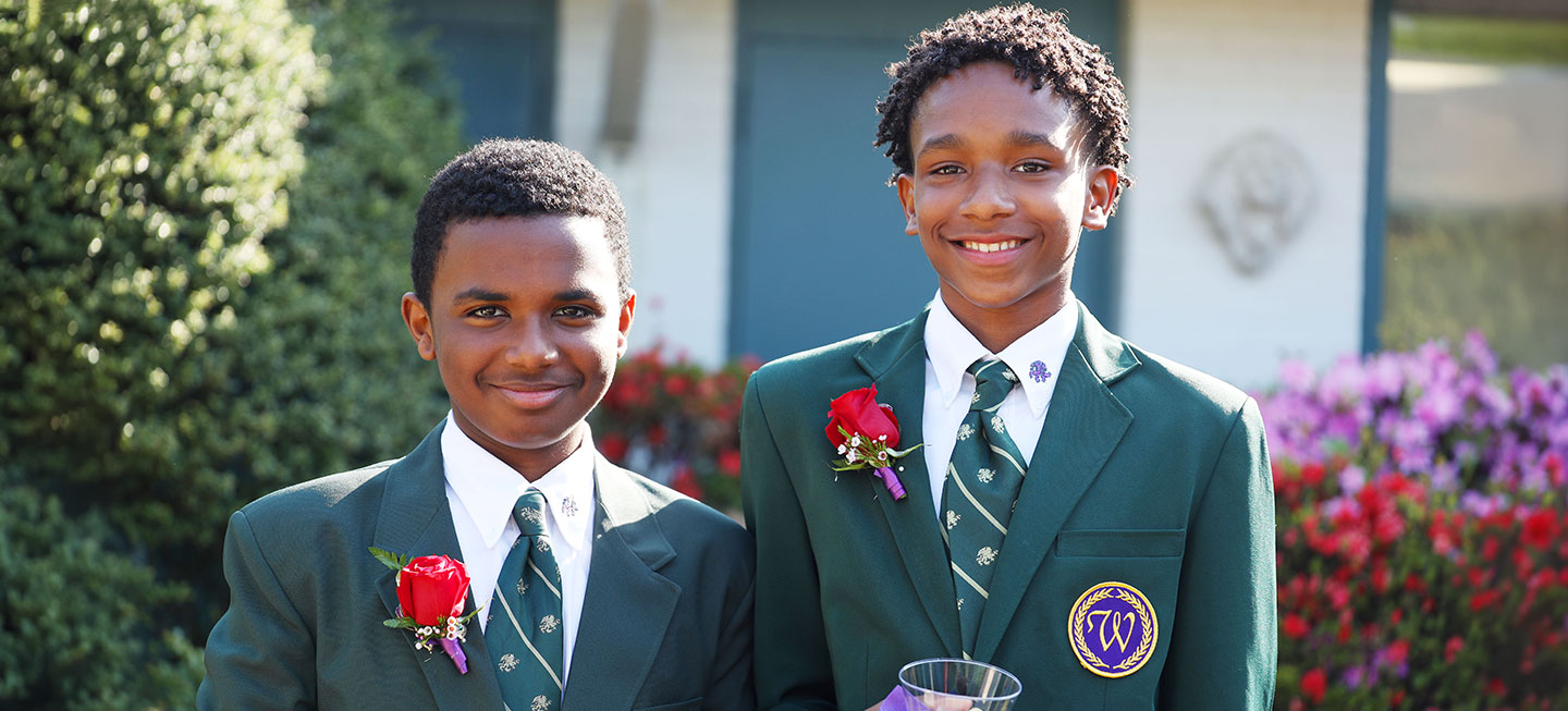 wo Westminster students in school blazers at a special school event.