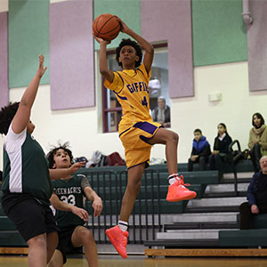 jump-shot Basketball player shooting a basketball mid air jump shot