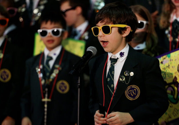 Music Program students singing into microphone