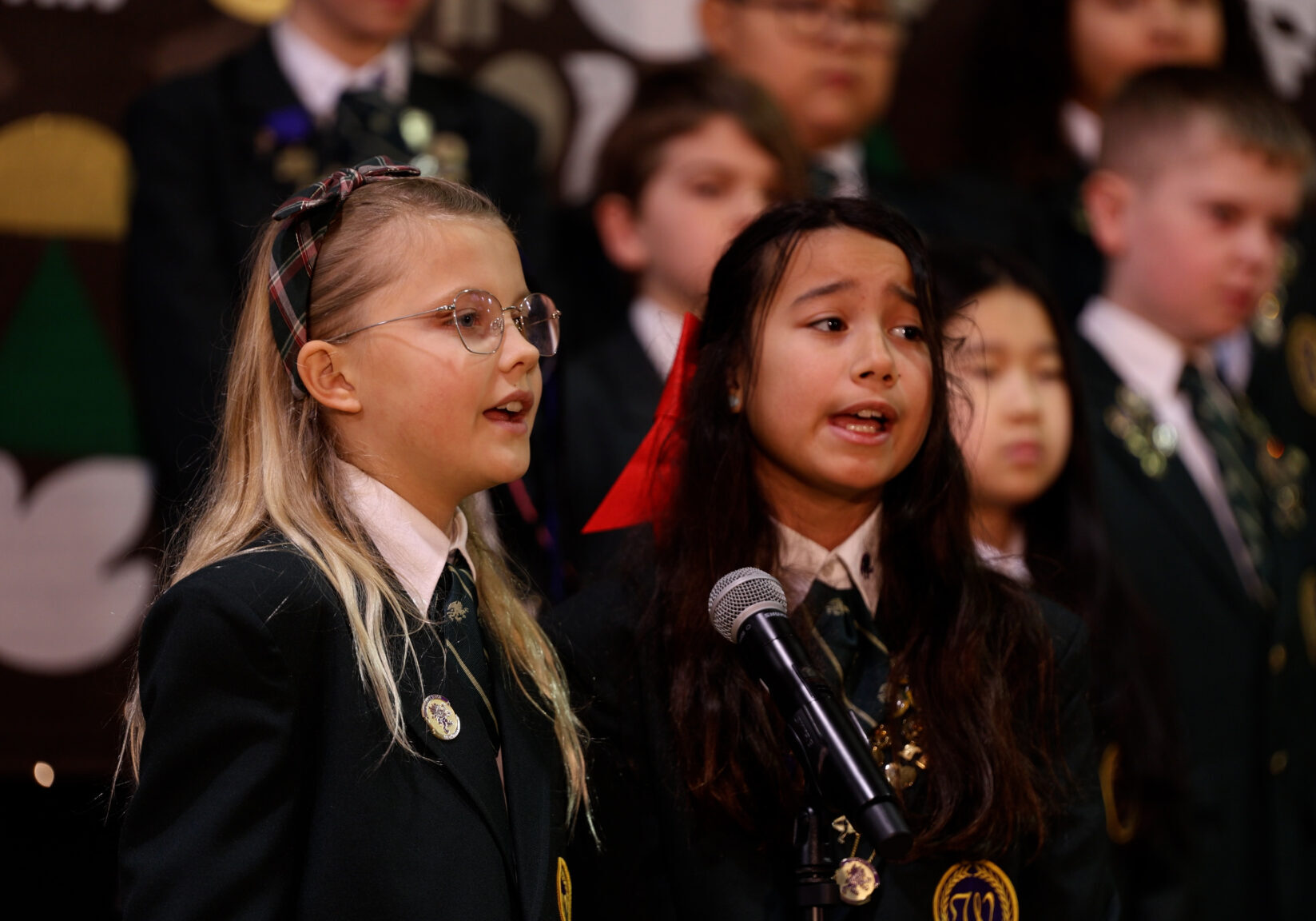 Music Program students singing into microphone