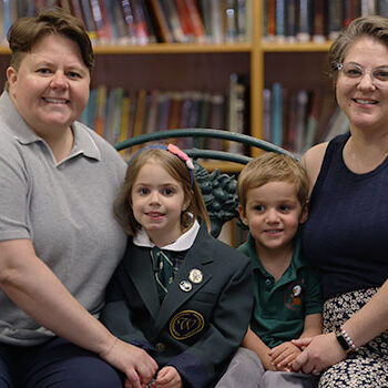 Philpott-Family Family photo sitting on bench in library